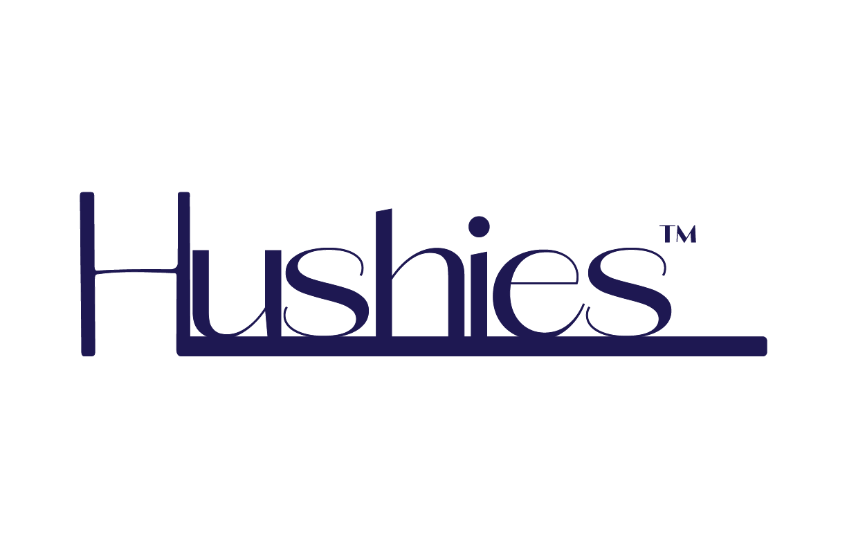 Hushies logo featuring simple navy blue text with a horizontal line extending from the letter s on white background