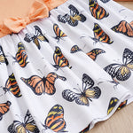 Baby Butterfly Dress Long Sleeve | Hushies Boutique showing butterfly print skirt with soft peach bow and gathered waist detail