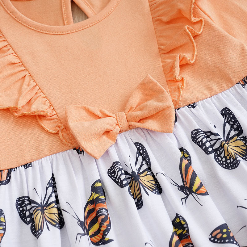 Baby Butterfly Dress Long Sleeve | Hushies Boutique with peach bodice, ruffled sleeves, and butterfly print skirt on soft fabric