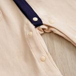 Elegant Gentleman Style Baby Outfit - Beige Cotton Jumpsuit with Checkered Collar close-up of snap buttons and fabric texture