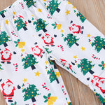 Baby Girls First Christmas Outfit – Ruffle Bodysuit Set showing festive pants with Santa, Christmas trees, and stars print on soft fabric