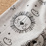 Gray fabric with black sun and cloud pattern