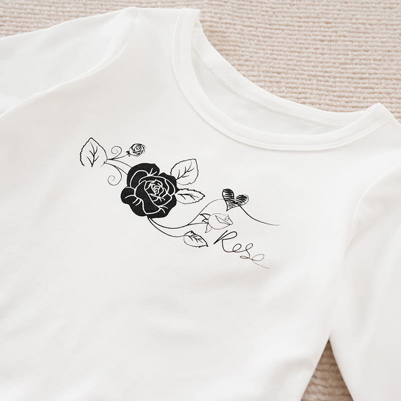 Adorable Little Lovebug Baby Girl Clothing Set - Soft Cotton Outfit for Infants with black rose and heart print detail on white fabric