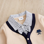 Elegant Gentleman Style Baby Outfit - Beige Cotton Jumpsuit with Checkered Collar and embroidered bow tie detail close-up