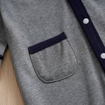 Baby Boy Cotton Gentleman Outfit - Soft, Stylish, Eco-Friendly Jumpsuit with Classic Design showing pocket and snap button details on gray fabric