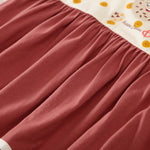 Gathered reddish-brown fabric with cream top featuring 'Happy Cookies' illustrations.