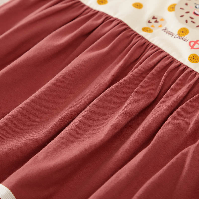 Gathered reddish-brown fabric with cream top featuring 'Happy Cookies' illustrations.