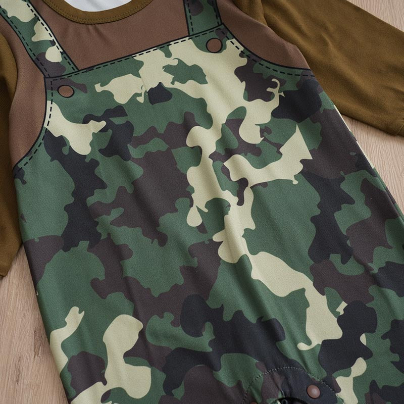 Camouflage-patterned overalls on a wooden surface