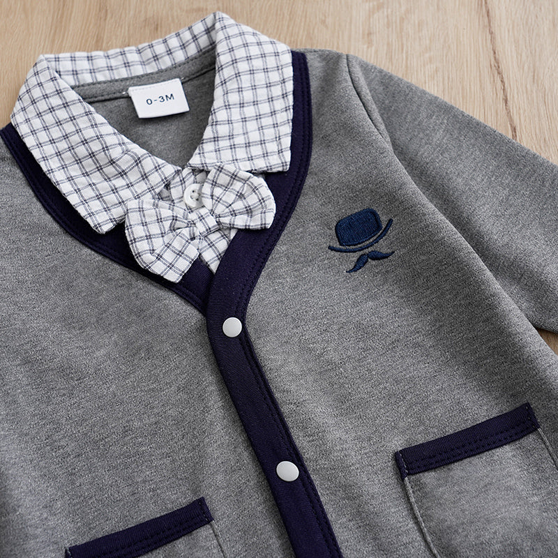 Baby Boy Cotton Gentleman Outfit - Soft, Stylish, Eco-Friendly Jumpsuit with Classic Design showing collar and bow detail on gray fabric
