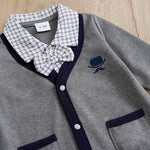 Baby Boy Cotton Gentleman Outfit - Soft, Stylish, Eco-Friendly Jumpsuit with Classic Design showing collar and bow detail on gray fabric