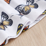Baby Butterfly Dress Long Sleeve | Hushies Boutique showing close-up of butterfly print detail on soft white infant clothing fabric
