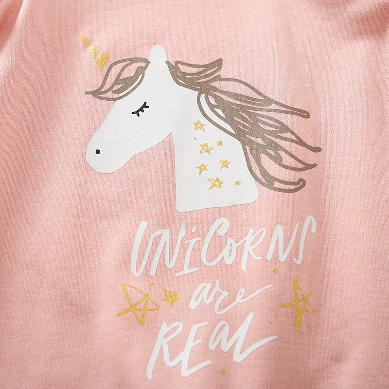 Unicorn Baby Jumpsuit Pink Romper | Hushies Soft Bow close-up of unicorn print and star accents on soft pink fabric