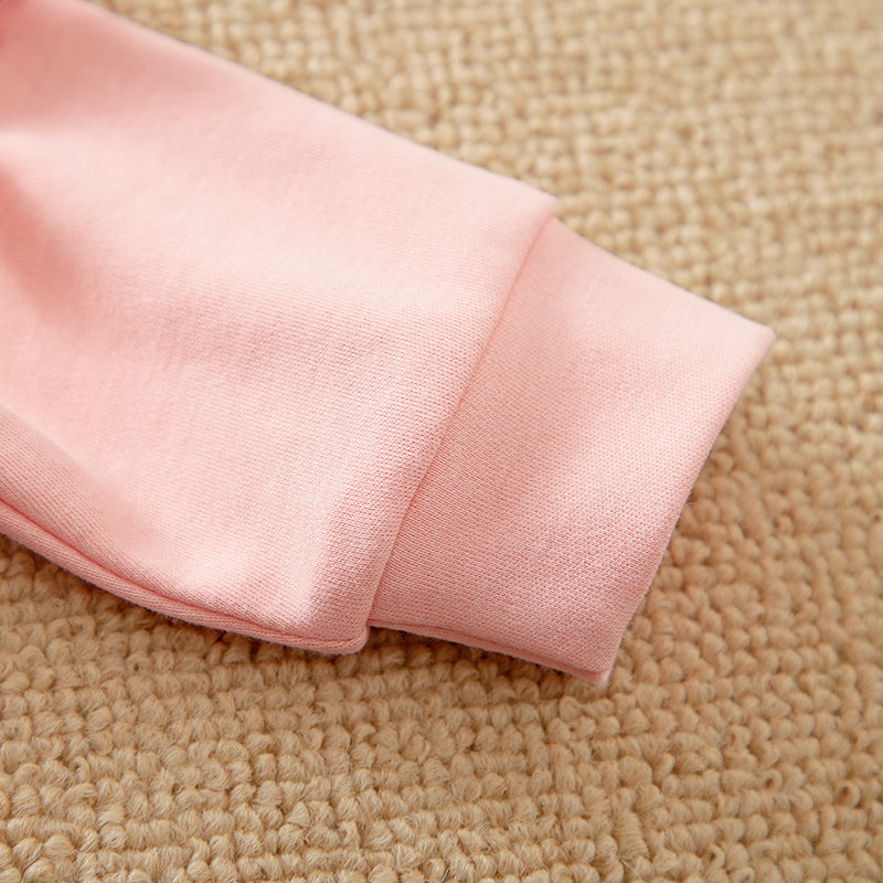 Unicorn Baby Jumpsuit Pink Romper | Hushies Soft Bow close-up of soft pink cuff on cozy infant romper sleeve