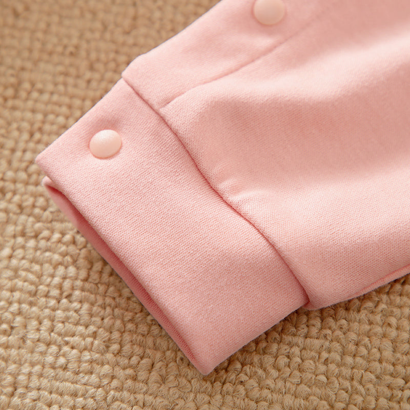 Unicorn Baby Jumpsuit Pink Romper | Hushies Soft Bow close-up of cuff with snap button on soft pink infant romper fabric
