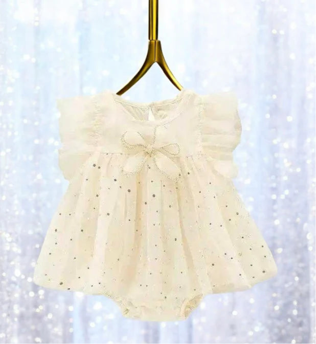 Sweet ivory romper dress for baby girls featuring a lovely white bow, ideal for making precious memories. 