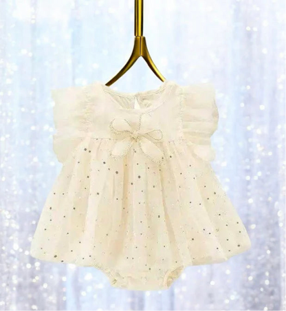 Sweet ivory romper dress for baby girls featuring a lovely white bow, ideal for making precious memories. 