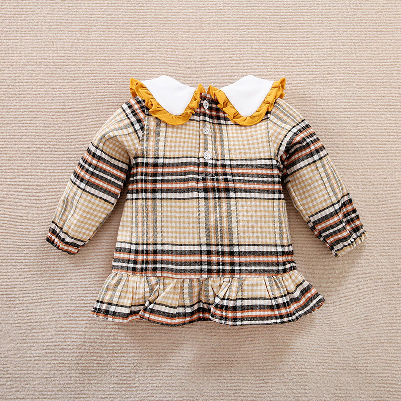 Back view of Plaid baby dress shirt with ruffled collar on a beige background