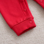 Adorable Baby Santa Jumpsuit & Hat Set - Soft Fabric, Easy Snap Closures, Holiday Fun with cozy red sleeve cuff and snap buttons detail