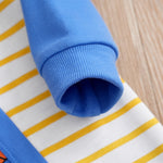 Builder Themed Baby Outfit for Boys - Tiny Builder Jumpsuit showing soft blue cuff and yellow striped fabric detail on baby clothing
