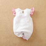 The Adorable 1-Piece Deer & Zebra Print Baby Romper features soft, breathable fabric and ruffle sleeves. This charming baby outfit includes a keyhole button closure at the back and pink trim, perfect for standout style.