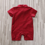 The Adorable 1-Piece Striped Infant Clothing Jumpsuit With Bow Tie & Button-Up Front is shown from the back, featuring red short sleeves, a collar, and vertical white pinstripes, laid flat on a light wood floor.