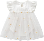 White baby romper dress with ruffled sleeves and daisy embroidered tulle skirt.
