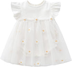 White cotton baby dress with ruffled sleeves and sheer skirt with daisies.