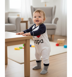 Adorable Unisex Baby Jumpsuit - I Love You Papa Design in Soft Cotton for Newborns. A toddler standing at a table in the cozy jumpsuit, ready for fun.