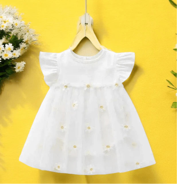 Adorable baby girl romper dress in white adorned with cheerful daisies, perfect for sunny days and special occasions.