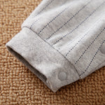 Gray Striped Baby Suit With Bow Tie - close-up of soft cuff and snap button detail on infant baby clothing sleeve
