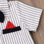 Striped baby jumpsuit with black bow tie and red pocket square.
