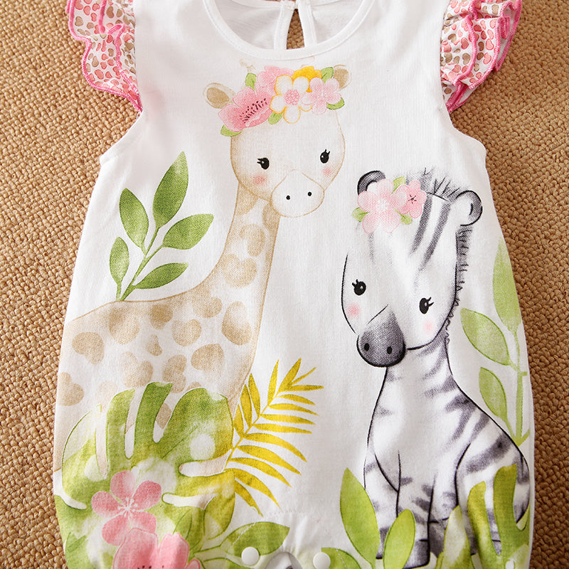 Baby romper with giraffe and zebra design on a brown surface