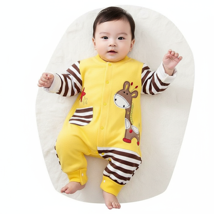 Baby Boy Jumpsuit in Soft Cotton with Giraffe & Star Designs, Snap Closure & Striped Sleeves, depicting a cute baby lying down in the cheerful yellow jumpsuit.