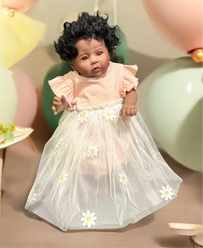 Adorable baby doll dressed in a white outfit with a flower crown, embodying cuteness and playful elegance.