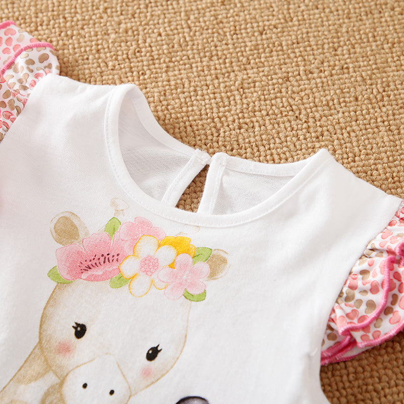 White baby romper with floral design on a beige carpet