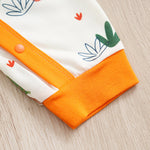 Adorable Giraffe Pattern Baby Outfit for Girls - Little Explorer Jumpsuit with orange trim and snap button closure on soft infant fabric