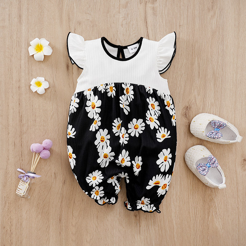 Sunshine Daisy Baby Romper Girls - Floral Summer Romper with flutter sleeves and daisy print on a black cotton fabric