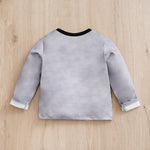 Back view of Gray sweatshirt on a wooden surface