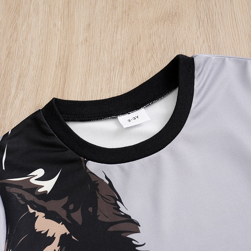 Close-up of a shirt with a black collar and a brand tag on a wooden surface