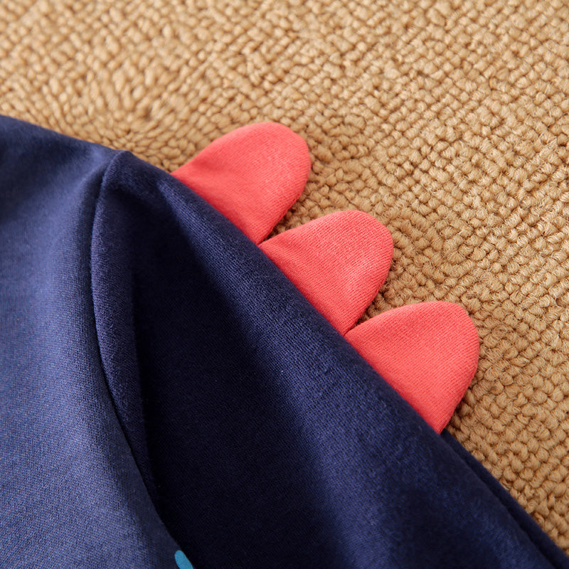 Soft Cotton Baby Dinosaur Jumpsuit With Cute Design, Long Sleeve & Easy Snap Closure close-up of red fabric dinosaur spikes on navy cotton romper