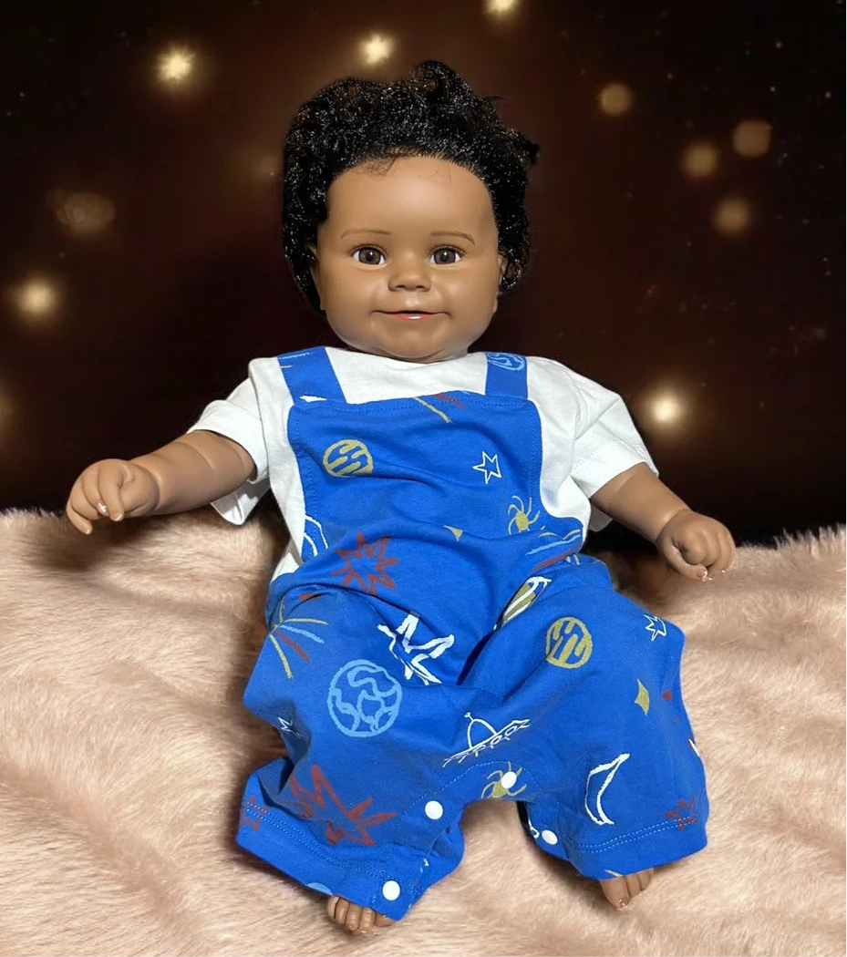 Cute doll in blue overalls and a white shirt, showcasing a stylish unisex baby blue star romper for playful moments.