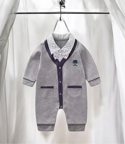 Adorable baby boy in a grey romper with a bow tie, perfect for any stylish occasion. Soft cotton for ultimate comfort.