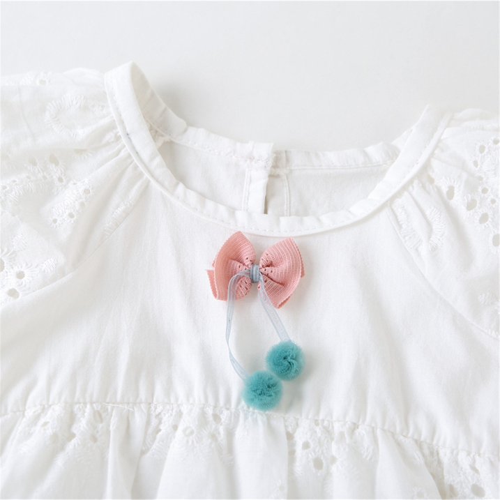 Baby Girl Cotton Romper Dress With Matching Hat – Soft, Breathable, Floral Design, Easy Diaper Access with bow and pompom detail close-up