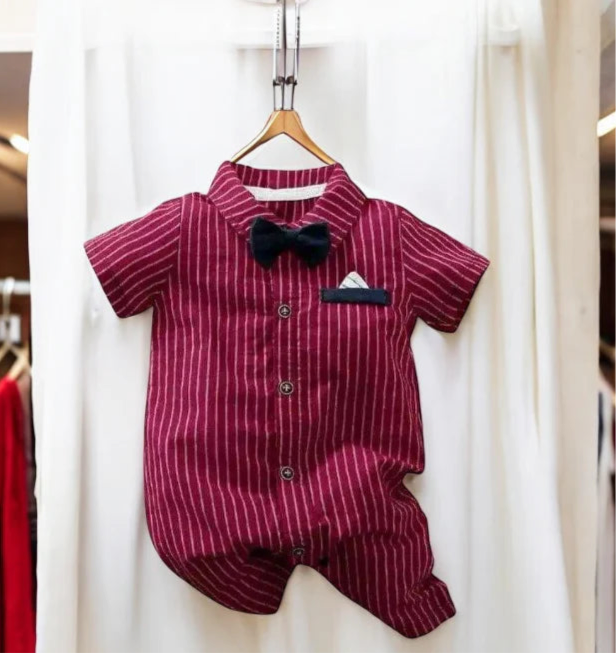 Cute baby boy wearing a red striped romper and a bow tie, showcasing a delightful and dapper look for little gentlemen.