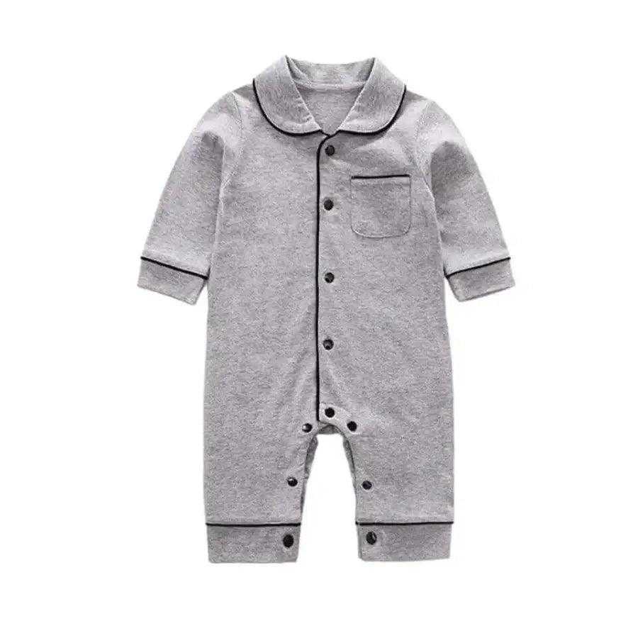 Adorable gray one-piece pajamas for baby boys, complete with black buttons for a charming and comfy look.