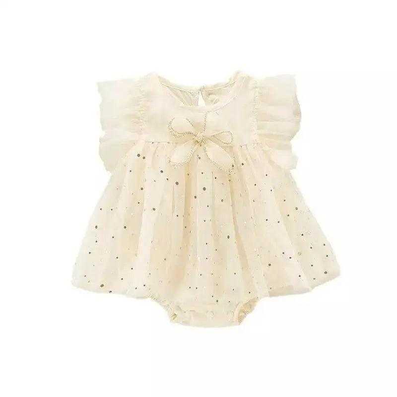 Close-up of a Baby Girl Romper Dress - Ivory with Sparkle Accents, Bow Detail & Ruffled Sleeves displayed elegantly, showcasing its delicate design and features.