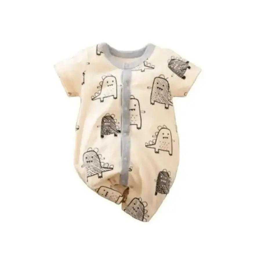 An adorable unisex baby romper with a playful cartoon print from Hushies, displayed neatly on a white background to show its soft cotton fabric.