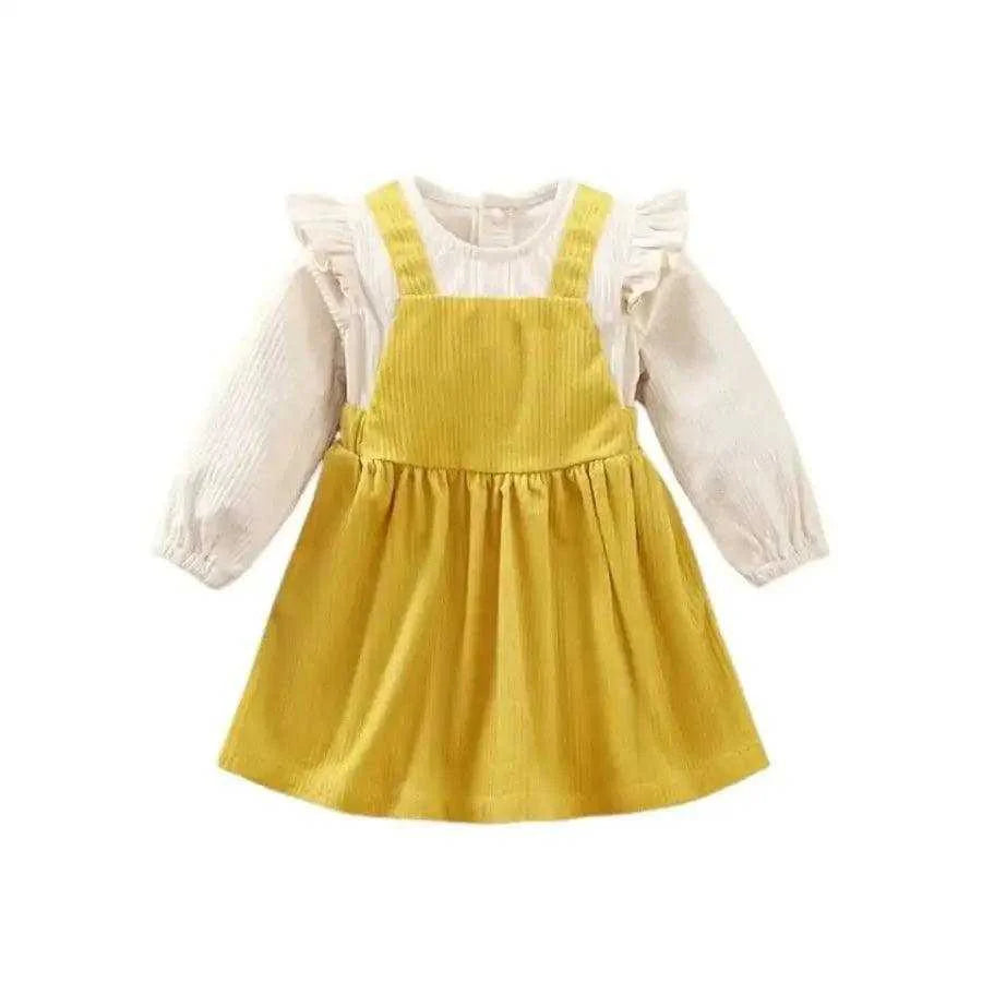 Flat lay of a yellow long sleeve dress with ruffles and soft cotton fabric, perfect for babies and toddlers.