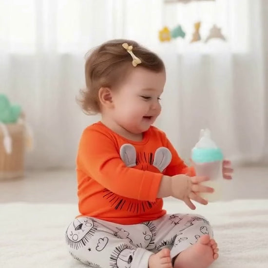 Video of baby drinking milk dress in a Unisex Lion Rawr Baby Bodysuit & Pants Set - Soft Cotton, Easy Diaper Change , 2 Piece Set