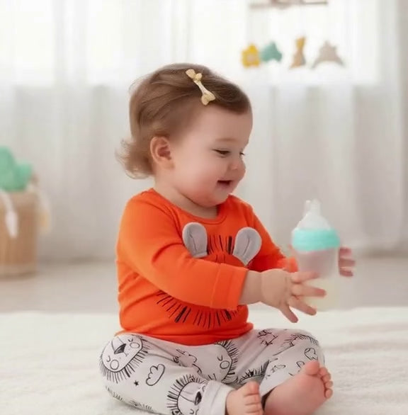 Video of baby drinking milk dress in a Unisex Lion Rawr Baby Bodysuit & Pants Set - Soft Cotton, Easy Diaper Change , 2 Piece Set